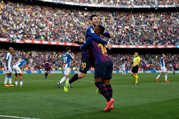 Messi celebrates with substitute Malcom after netting Barca&#039;s second goal during their 2-0 win vs Espanyol