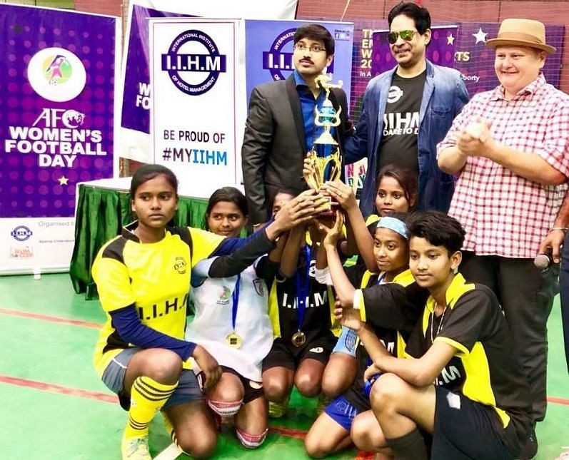 From left: Aparup Chakraborty, Dr. Suborno Bose and Paul Walsh pose with winning team Super Woman