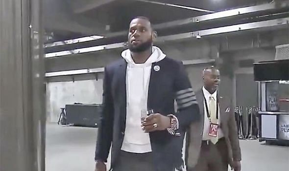 LeBron James showed up for a game with a glass of wine in his hand.