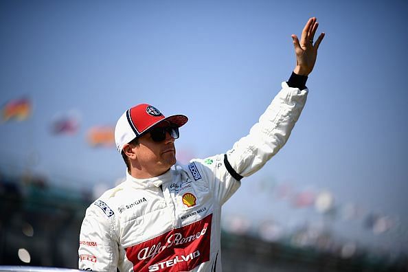2007 Formula One World Champion Kimi Raikkonen waves at the crowd during the 2019 F1 Grand Prix of Australia
