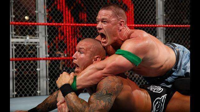 John Cena traps Randy Orton in the dreaded STF submission hold.