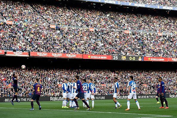 Messi watches his audacious free-kick as it floats goalwards to break the deadlock against Espanyol