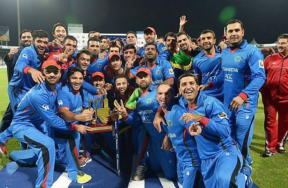 Afghanistan team celebrates after beating Zimbabwe in an ODI series.