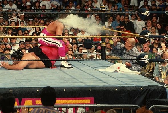 Mr. Fuji throws salt at an unsuspecting Bret Hart