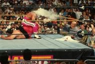 Mr. Fuji throws salt at an unsuspecting Bret Hart