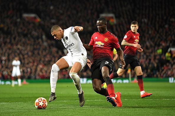 Kylian Mbappe and Eric Bailly in action in the first leg