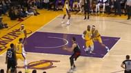 Kuzma shoves LeBron James (No. 23) to close the open shooter.
