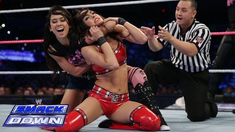AJ Lee puts the moves on Brie Bella