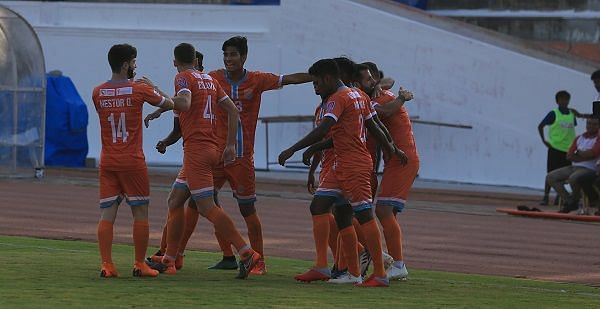 Chennai City FC players celebrate after a goal