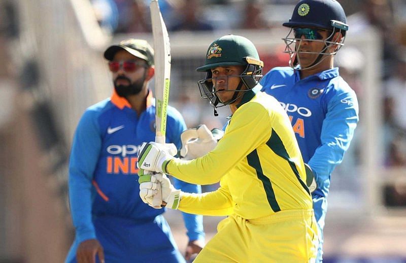Usman Khawaja struck his maiden ODI ton to help Australia beat India.