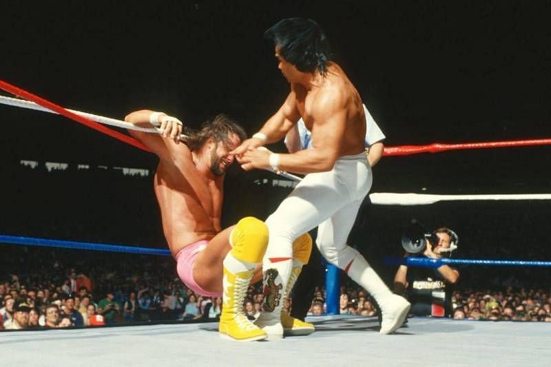 Ricky Steamboat attacks a tied-up Randy Savage