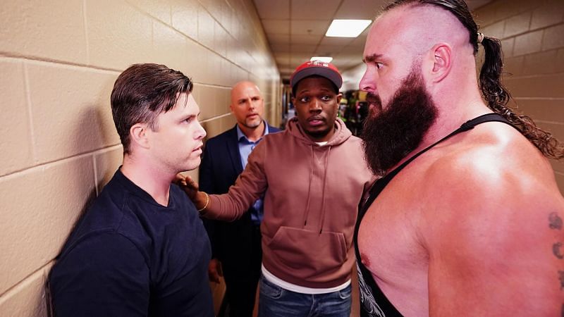 Colin Jost and Michael Che with Braun Strowman