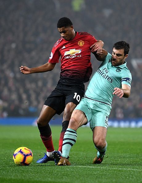 Marcus Rashford grappling with Sokratis