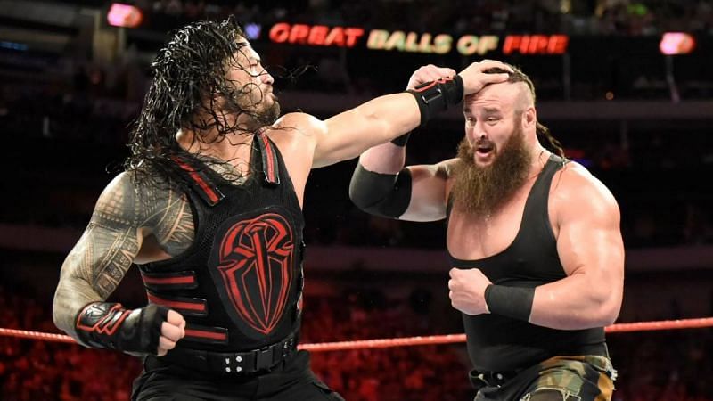 Roman Reigns punches Braun Strowman