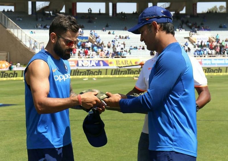 Dhoni presents army cap to Indian captain Virat Kohli
