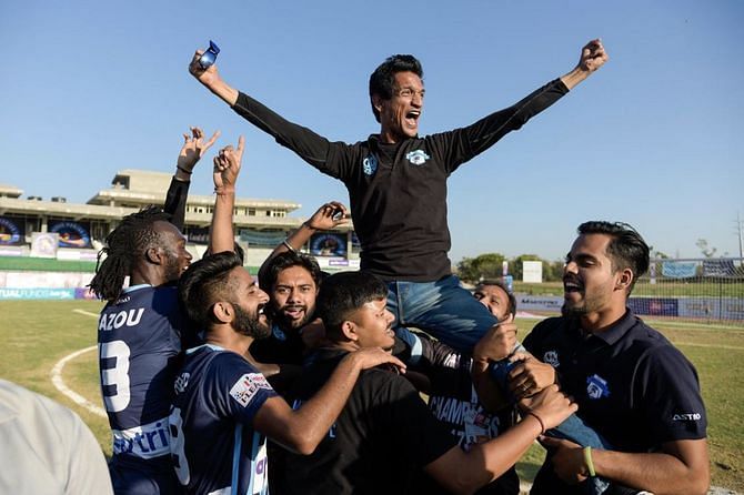 Minerva Punjab players lift owner Ranjit Bajaj while celebrating their I-League title victory