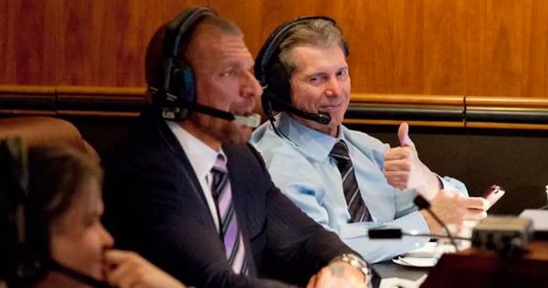 Vince and Triple H communicate with the referees from backstage!