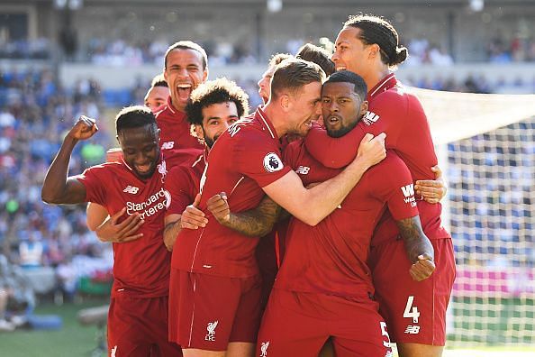 Liverpool players celebrate after Wijnaldum&#039;s goal against Cardiff