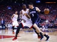 Magic All-Star Nikola Vucevic (9) and Toronto's Serge Ibaka tussling near the paint