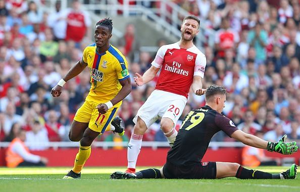 Mustafi reacts after Crystal Palace&#039;s Wilfried Zaha scores a goal against Arsenal