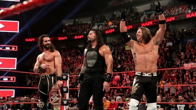Seth Rollins, Roman Reigns and AJ Styles celebrate after their match last week on RAW
