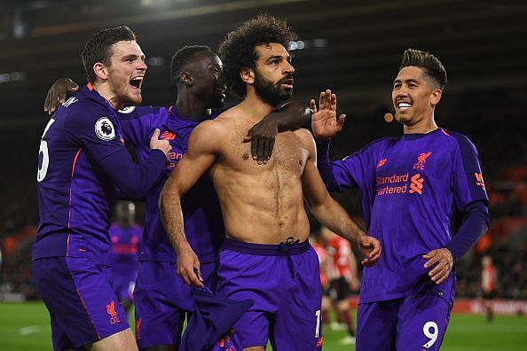 Mohamed Salah celebrates with his teammates