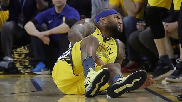 Cousins winces in pain after going down in the first quarter of Game 2.