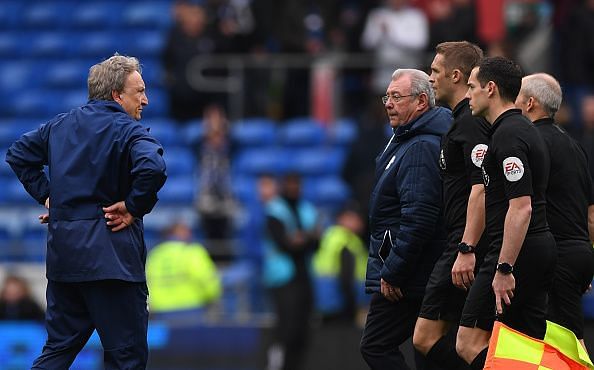 Neil Warnock has a stare down with the refereeing team after full time against Chelsea FC