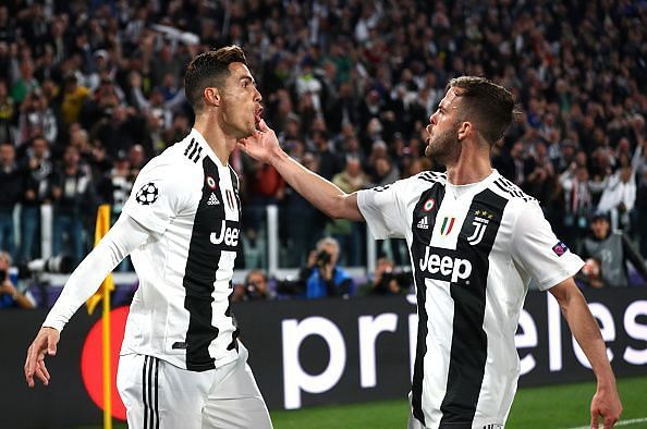 Ronaldo celebrating his opener with Miralem Pjanic, whose cross was duly converted by the Portuguese