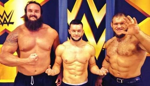 Finn Balor with Braun Strowman and Lars Sullivan