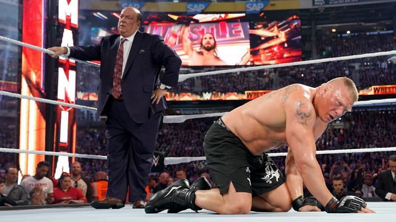 Brock Lesnar and Paul Heyman look shellshocked after Lesnar&#039;s loss to Seth Rollins