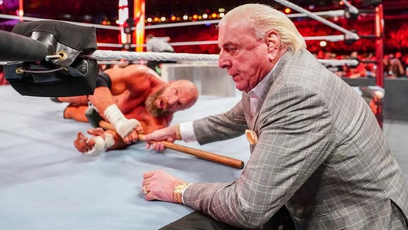 Ric Flair had to aid Triple H towards the end of the match