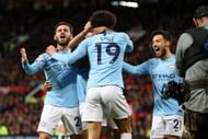 Bernardo, Sane and David Silva celebrate during City's 2-0 win over their neighbours