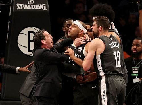 Jared D'Angelo Russell Joel Embiid and Jarrett Allen scampering for the ball Dudley being held back after the 3rd quarter scuffle