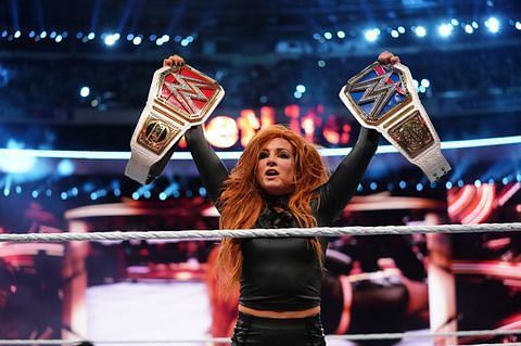 Becky Lynch holding both the RAW and Smackdown Live Women&#039;s Championships at WrestleMania 35
