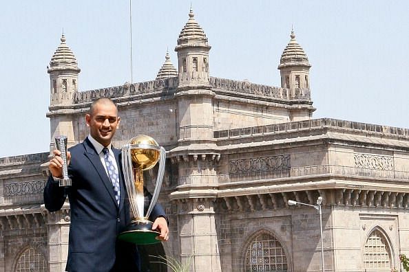 Dhoni posing with the World Cup trophy in Mumbai