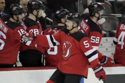 Carrick scores late as Devils beat Rangers, avoid sweep