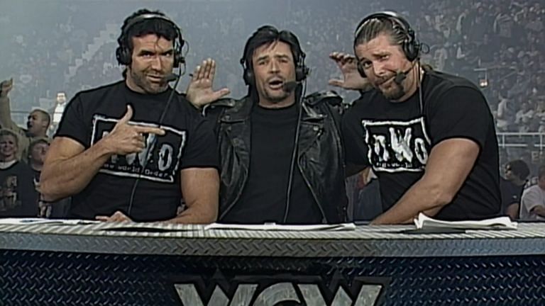 Eric Bischoff, flanked by Scott Hall and Kevin Nash