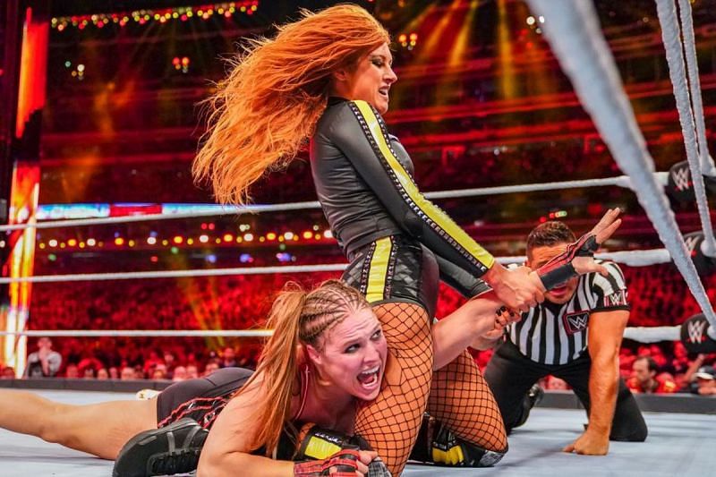 Becky Lynch locking the Disarmher on Ronda Rousey.