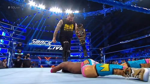 Owens holding the WWE Title