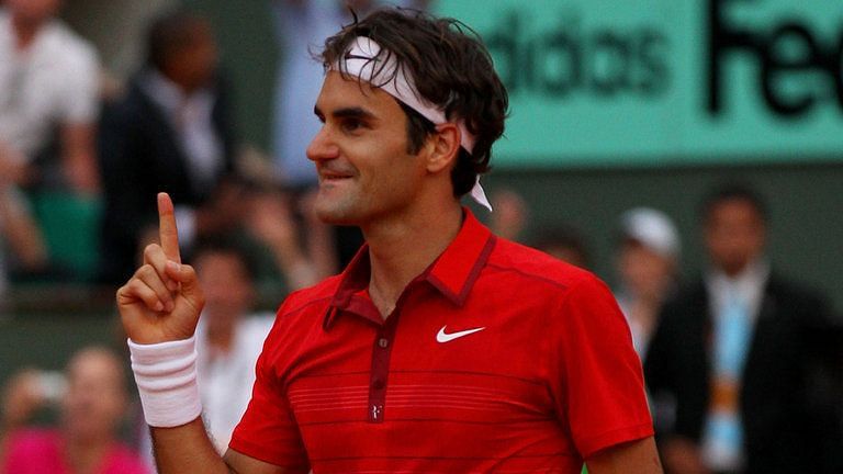 Roger Federer celebrating his victory over Novak Djokovic in the semi-finals of the 2011 French Open