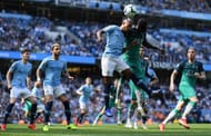 Tottenham's Davinson Sanchez involved in an aerial duel with Fernandinho of Manchester City