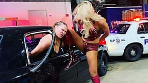WWE News: Charlotte Flair taunts Ronda Rousey after brawl on RAW for calling wrestling fake