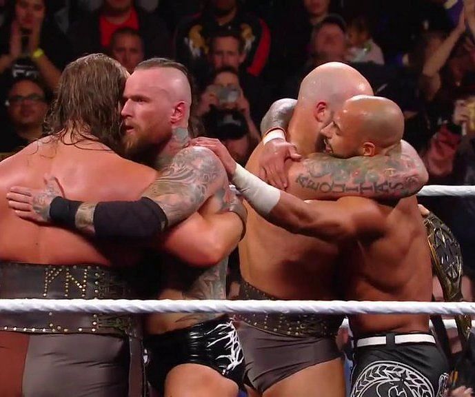 War Raiders, Ricochet and Aleister Black embrace after their epic NXT TakeOver: New York bout