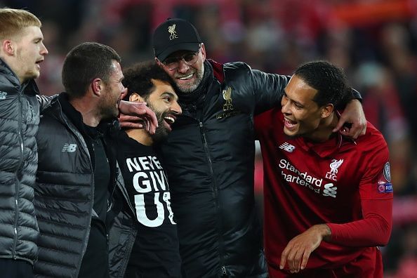 Klopp embracing Salah and Van Dijk after qualifying for a second consecutive final