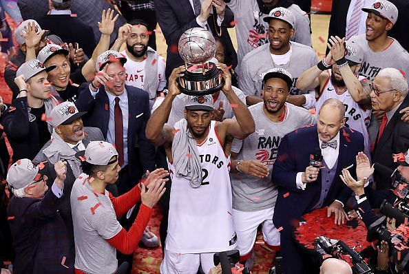 Kawhi Leonard holds the Eastern Conference Finals Trophy