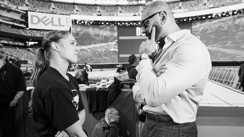 Batista and Ronda Rousey interacting behind-the-scenes at WrestleMania 35