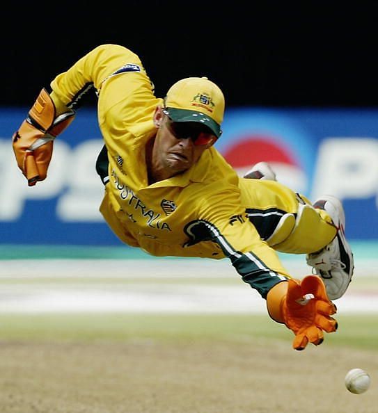Adam Gilchrist of Australia dives for the ball