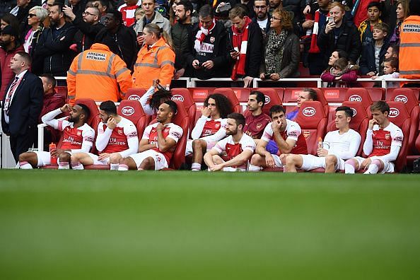 Arsenal players look dejected after failing to secure a win over Brighton