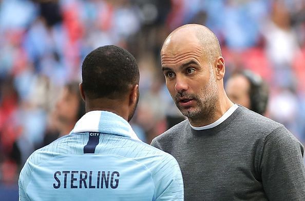 Pep Guardiola talks to Raheem Sterling after winning the FA Cup